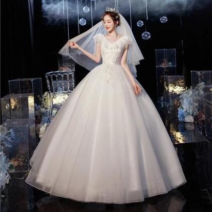 Elegant Cap Sleeve Embroidered Ball Gown Wedding..