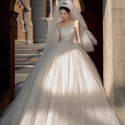 Elegant Strapless Bridal Gown With Beaded Bodice