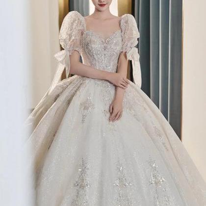 Elegant Sparkling Off-shoulder Bridal Gown With..