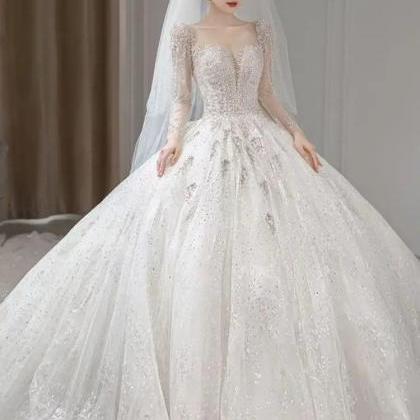 Elegant Long-sleeve Beaded Ball Gown Bridal Dress