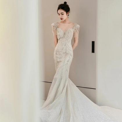 Elegant Off-shoulder Sequin Mermaid Bridal Gown