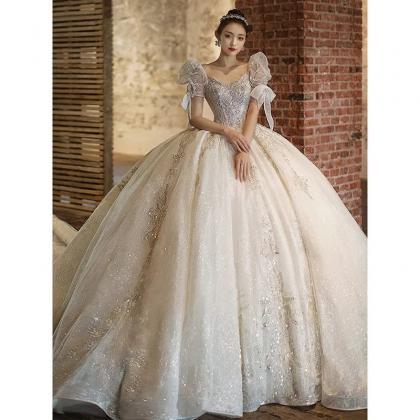 Elegant Off-shoulder Sequined Bridal Gown With..