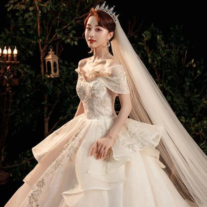 Elegant Off-shoulder Bridal Gown With Long Train
