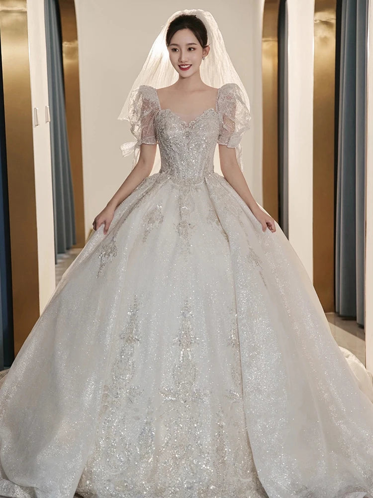 Elegant Sparkling Off-shoulder Bridal Gown With Veil
