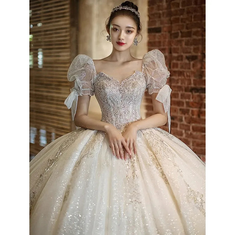 Elegant Off-shoulder Sequined Bridal Gown With Puff Sleeves