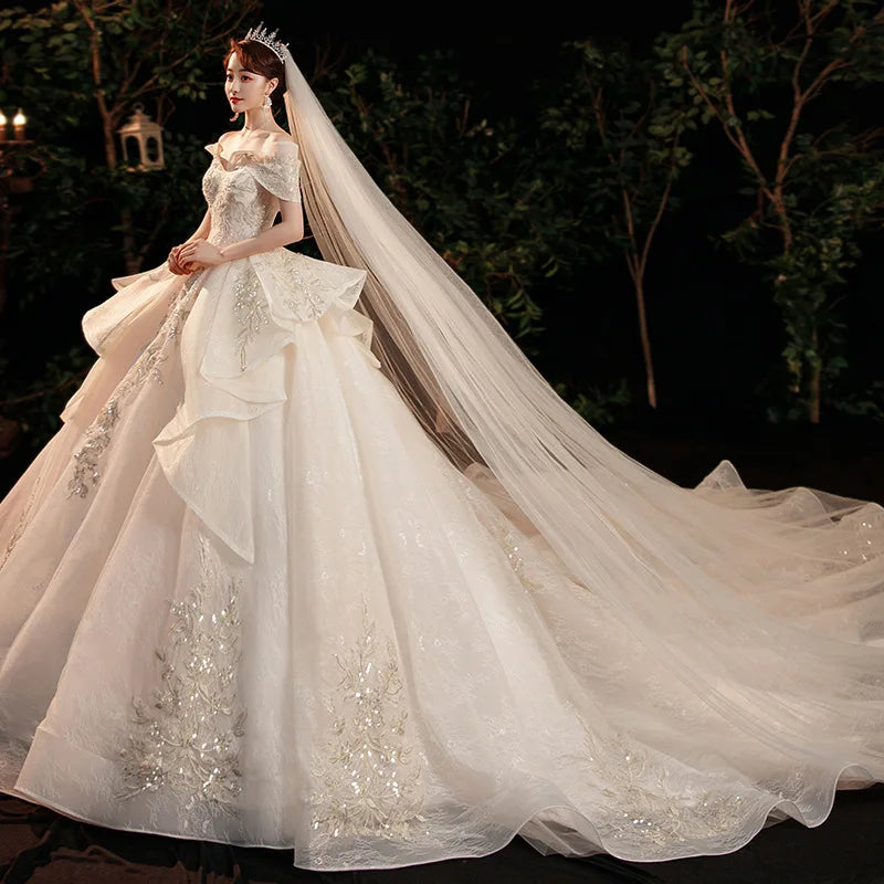 Elegant Off-shoulder Bridal Gown With Long Train