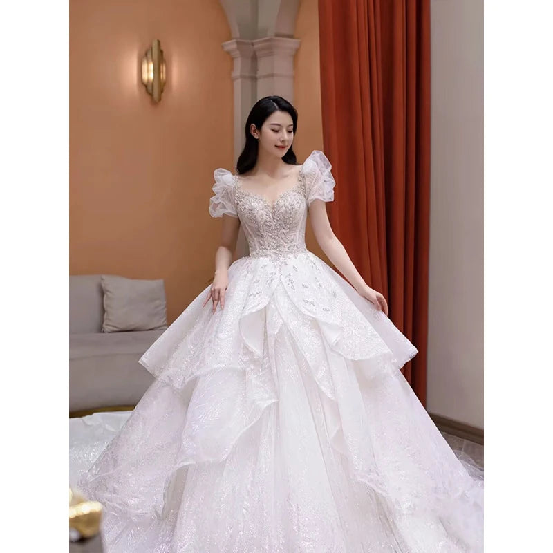 Elegant Off-shoulder Lace Bridal Gown With Train