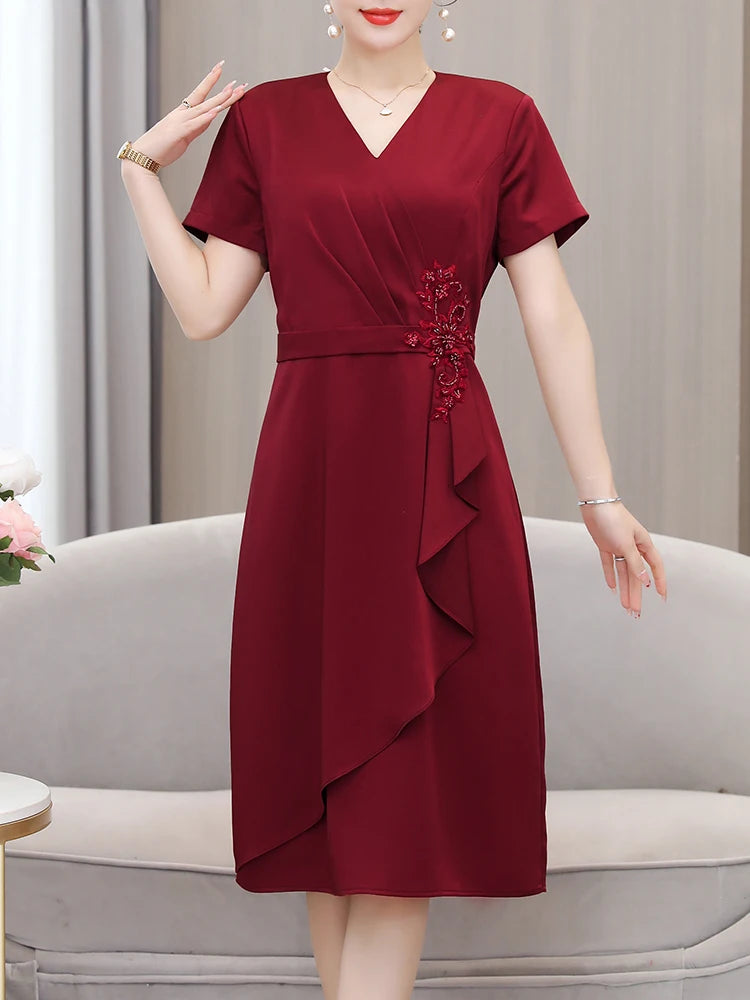 Elegant Burgundy Wrap Dress With Floral Embellishment