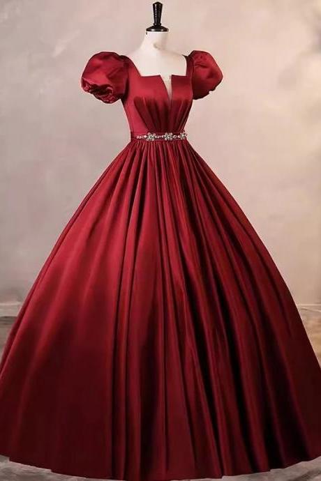 Elegant Red Satin Gown With Puffed Sleeves And Embellishments