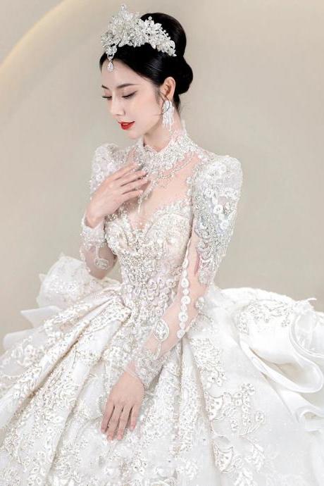 Luxurious Beaded Long-sleeve Bridal Gown With Train