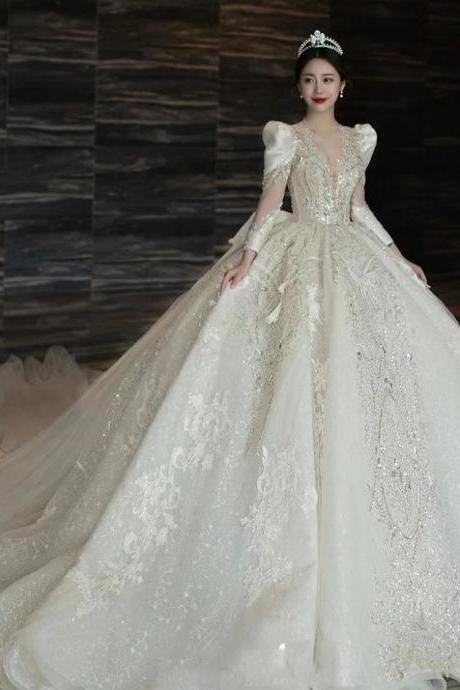 Luxurious Beaded Ball Gown Wedding Dress With Sleeves