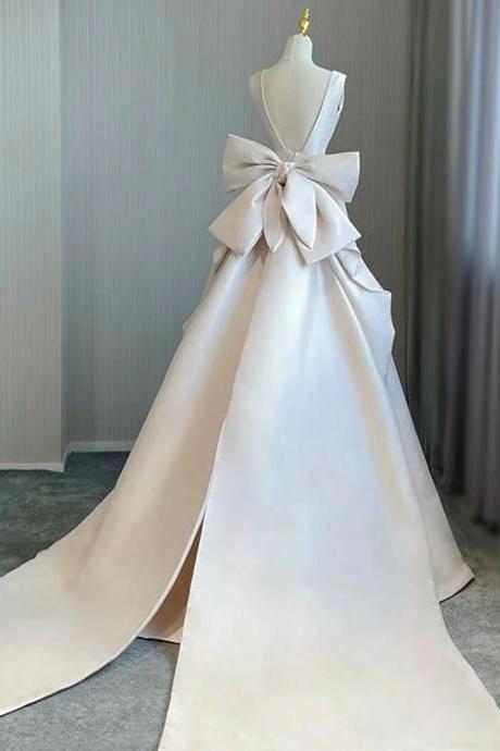 Elegant Satin Bridal Gown With Large Bow Train