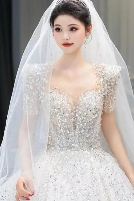 Elegant Beaded Bodice Bridal Gown With Sheer Veil
