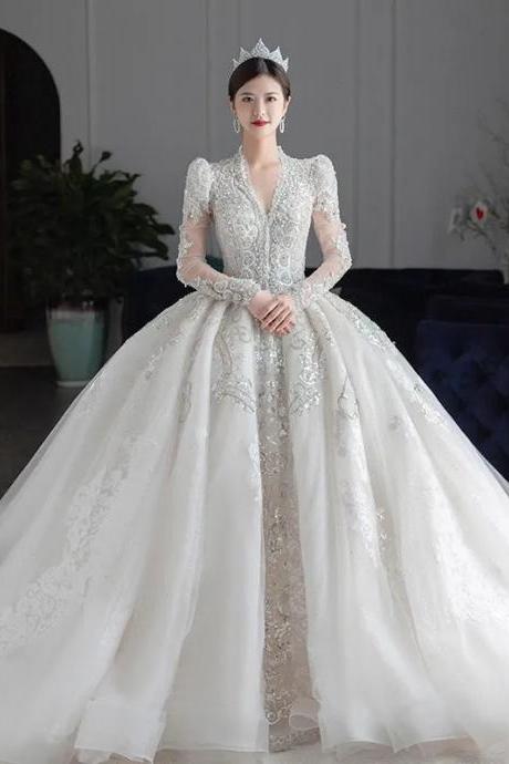 Elegant Long-sleeve Lace Bridal Gown With Train