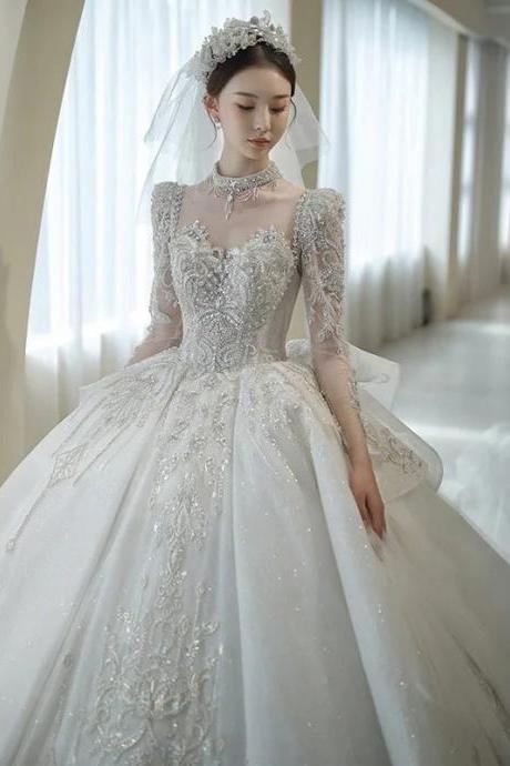 Elegant Long-sleeve Beaded Ball Gown Wedding Dress