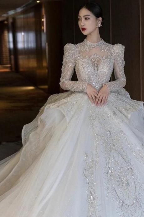 Elegant Long-sleeve Lace Beaded Bridal Gown With Train