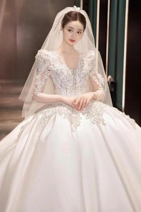 Elegant Full-length Wedding Gown With Lace Embellishments