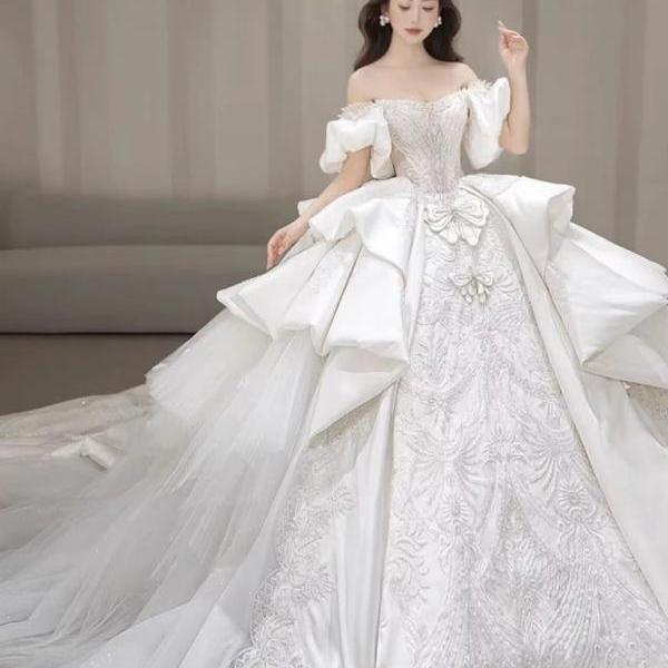 Elegant Off-Shoulder Bridal Gown with Embroidered Detailing