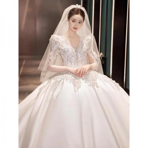Elegant Full-Length Wedding Gown with Lace Embellishments