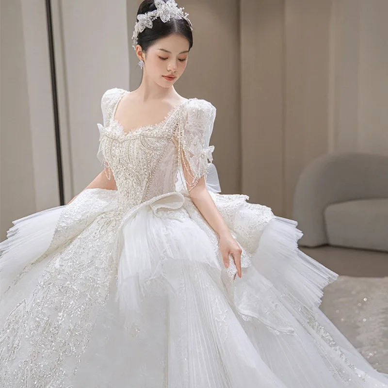 Elegant Off-shoulder Sequin Lace Bridal Gown With Train on Luulla