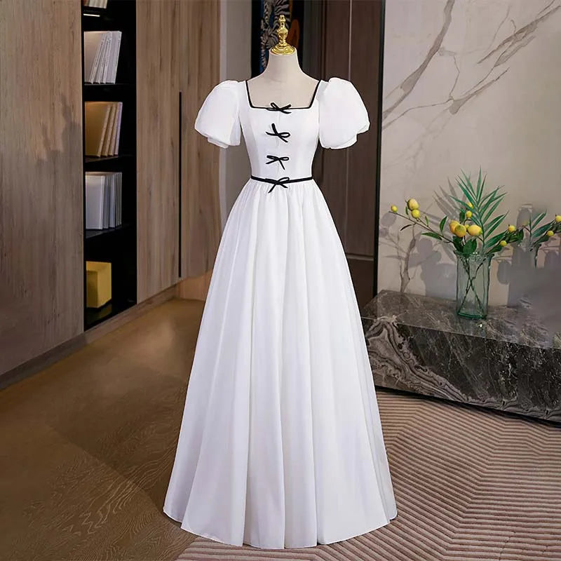 Elegant White Gown With Black Bow Accents on Luulla
